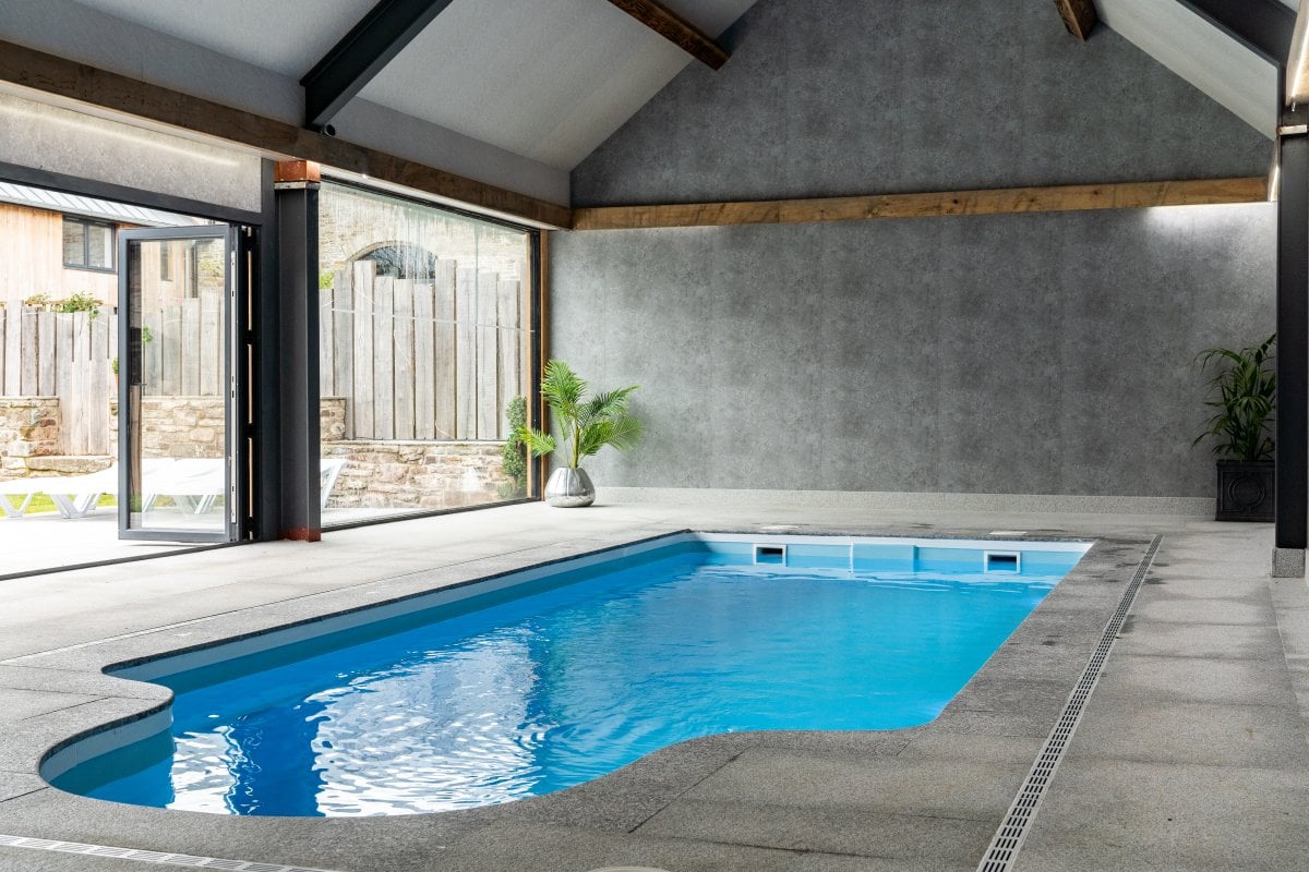 The Courtyard Wales - indoor pool with access to sun terrace